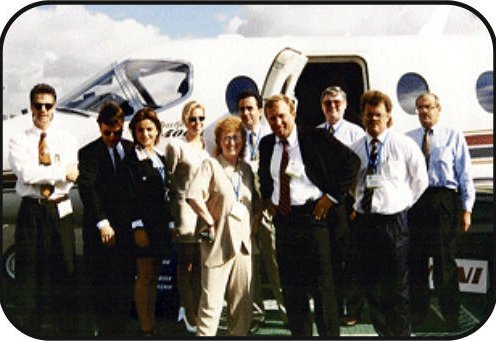 The full team beside a client aircraft